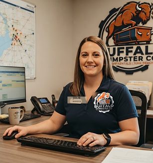 Julie, Buffalo Dumpster Co. dispatcher, taking a booking in the office