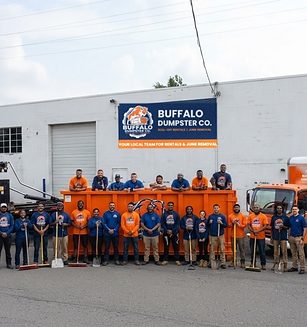 The Buffalo Dumpster Co. crew with a roll-off truck