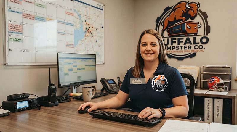 Julie taking a booking at the dispatch desk